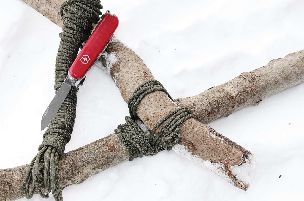 Paracord works fine for lashing wood, and the Swiss Army knife cuts the 'cord to just the right lengths.