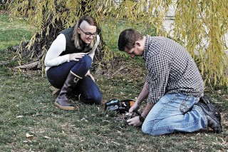 The author and her husband, a U.S. Army paratrooper, practice some fire-starting techniques.