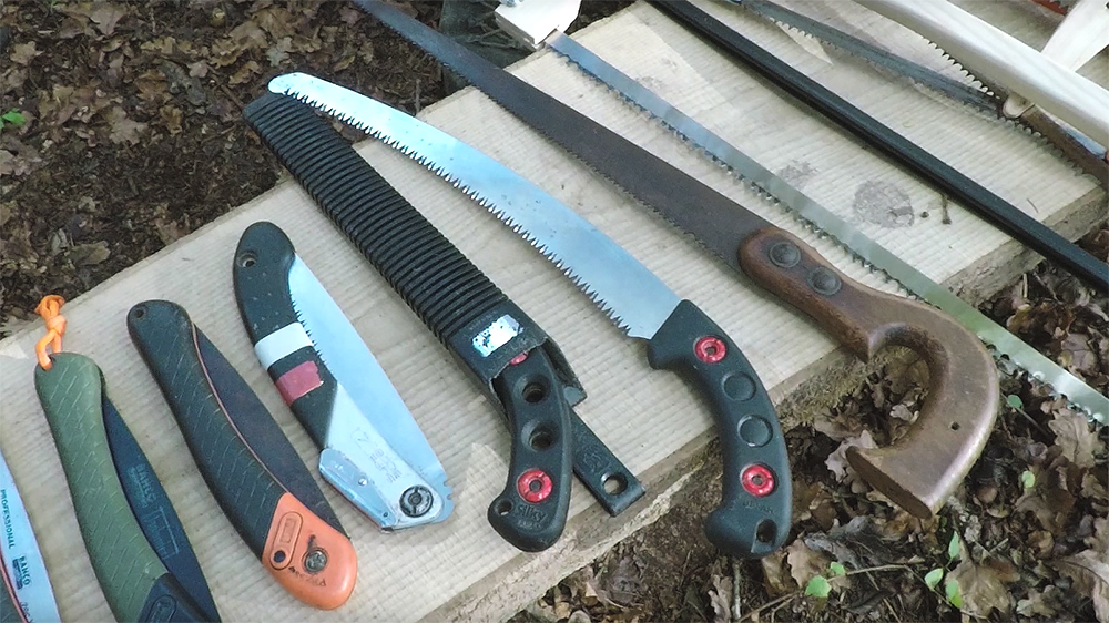 Photo of numerous types of fixed and folding field saws.