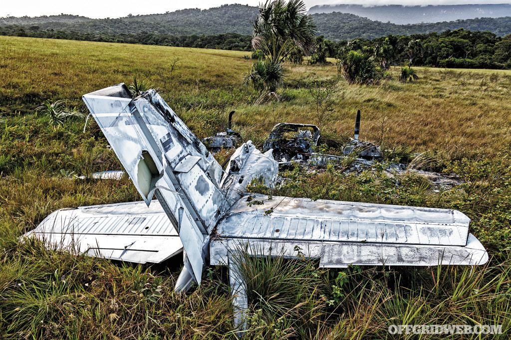 Burnt airplane wreckage at end of runway in Uruyen, Auyantepuy, Venezuela