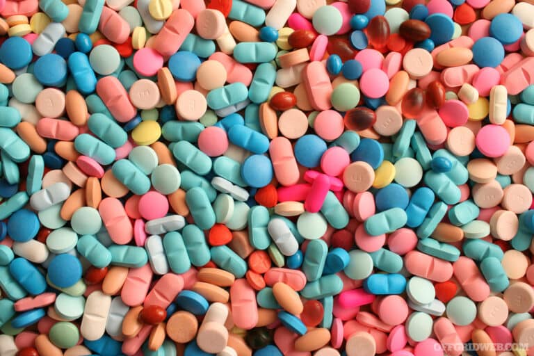 Top view of a large amount of medicinal tablets and capsules.