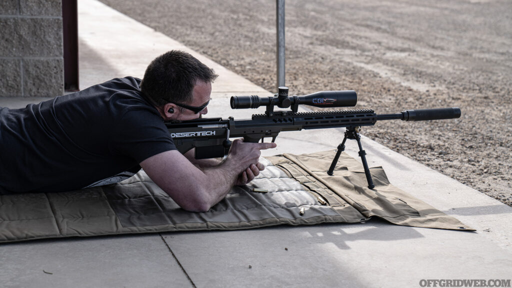 Photo of Patrick Diedrich firing a Desert Tech rifle.