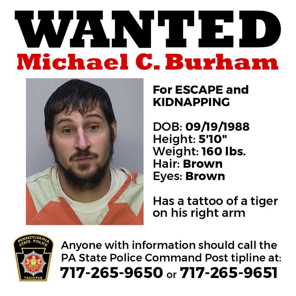 Wanted poster for escaped fugitive Michael Burham.