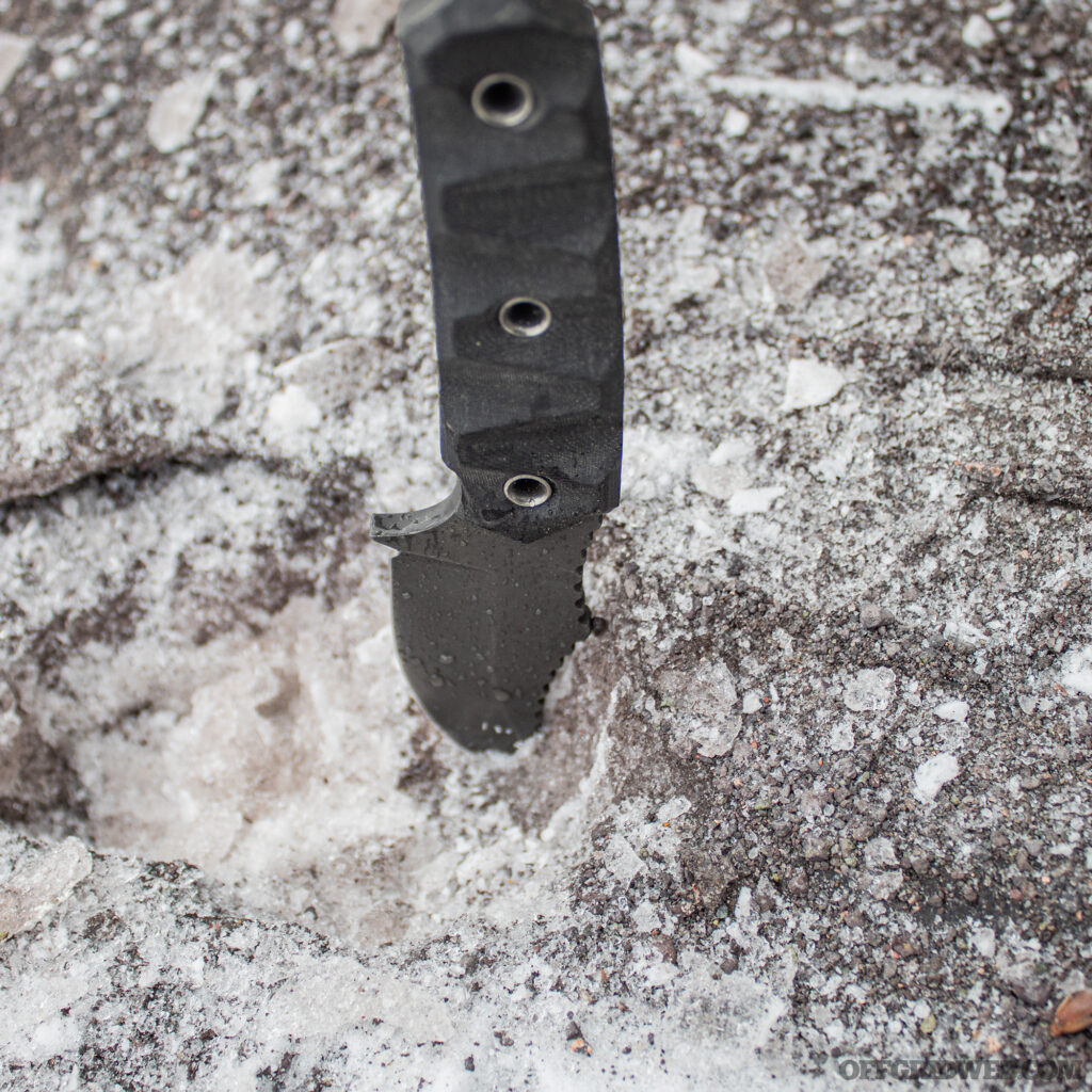 Photo of the POPS MK2 sticking tip first out of a concrete mix of ice and gravel.