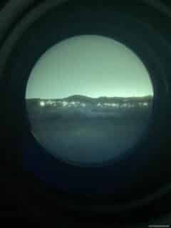 Photo of the view through night vision goggles.