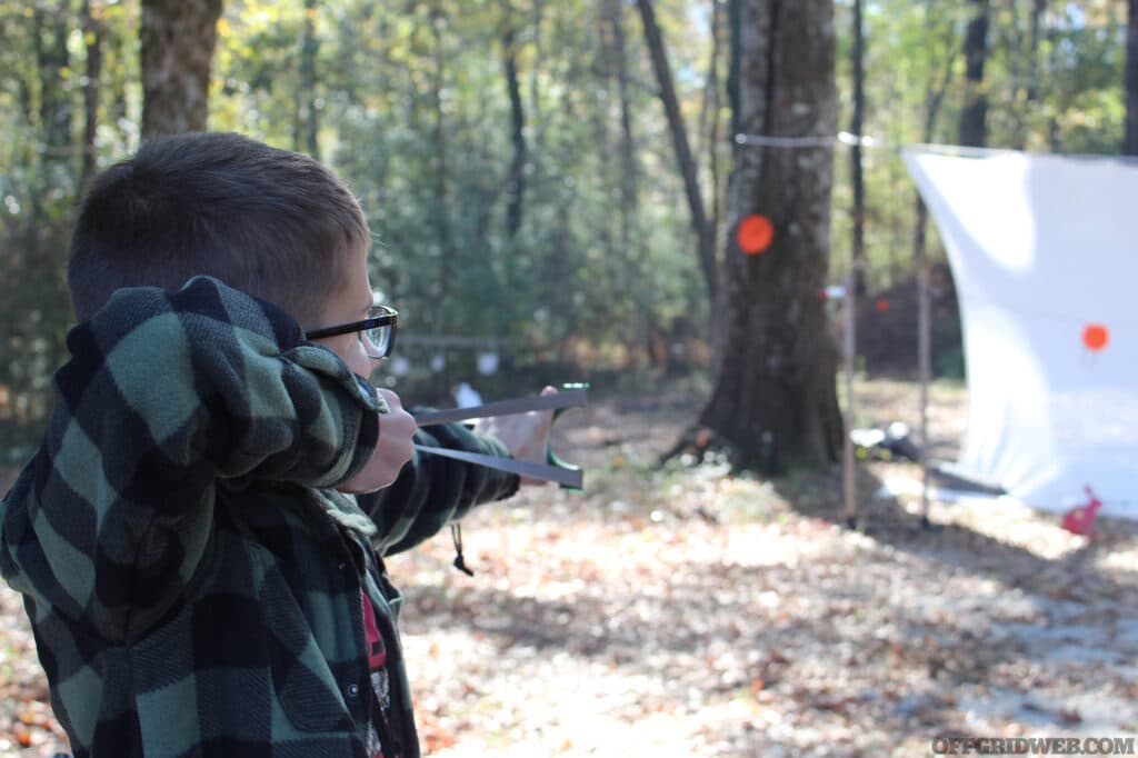 Slingshot shooter takes aim with proper technique.