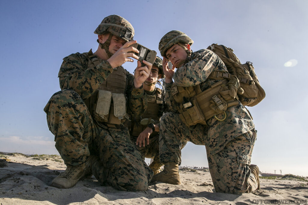 From left, U.S. Marine Corps Sgt. Christopher N. Lupyak, Lance Cpl. Joseph Burns, and Lance Cpl. Nolan Jaros, all combat engineers with the Littoral Engineer Reconnaissance Team, 9th Engineer Support Battalion, 3d Marine Logistics Group, utilize the Android Tactical Assault System to aid in a reconnaissance patrol during a littoral mobility and detection exercise on Camp Pendleton, California, Nov. 18, 2021. The ATAK is a tool that allows Marines to rapidly report critical geospatial information to support intelligence requirements for a given objective. During this exercise, 7th and 9th ESB are refining their skills with emerging Marine Corps technologies in order to facilitate follow-on forces’ littoral mobility from shallow water to the objective. (U.S. Marine Corps photo by Sgt. Hailey D. Clay)