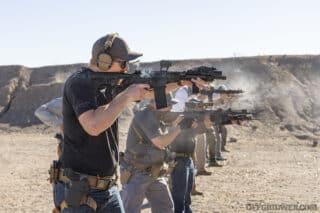 Photo of a firing line of students practicing carbine shooting drills.