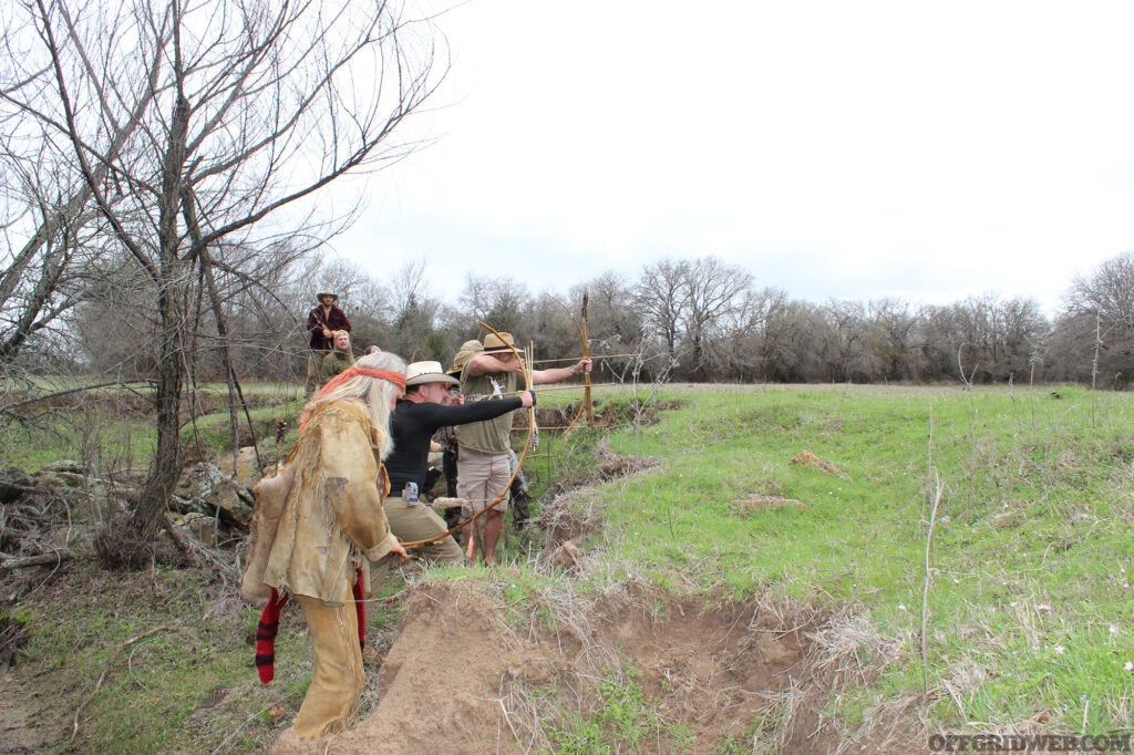 Photo of primitive wilderness survival students staging at an ambush site.
