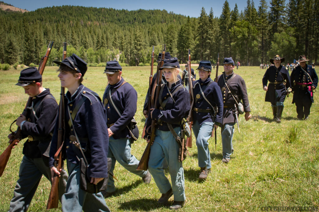 Photo of civil war reenactors on a road march.