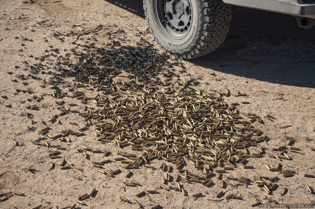 A pile of spent brass casings on the ground after Dillon Aero's minigun sent rounds down range.