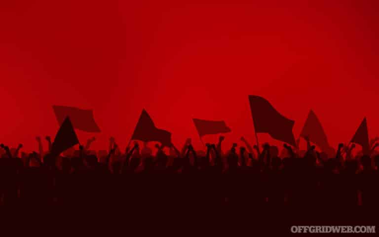 Silhouette group of people Raised Fist and flags Protest in flat icon design with red color sky background