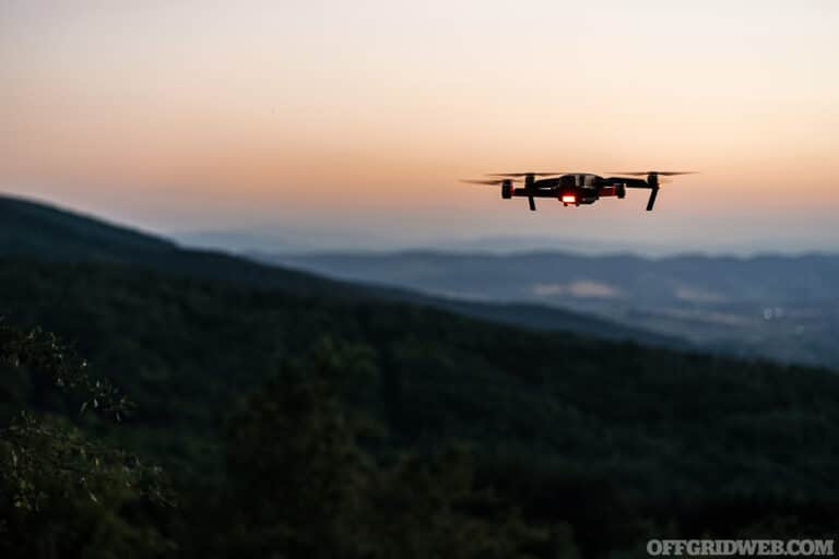 Drone flying over a mountain at dusk