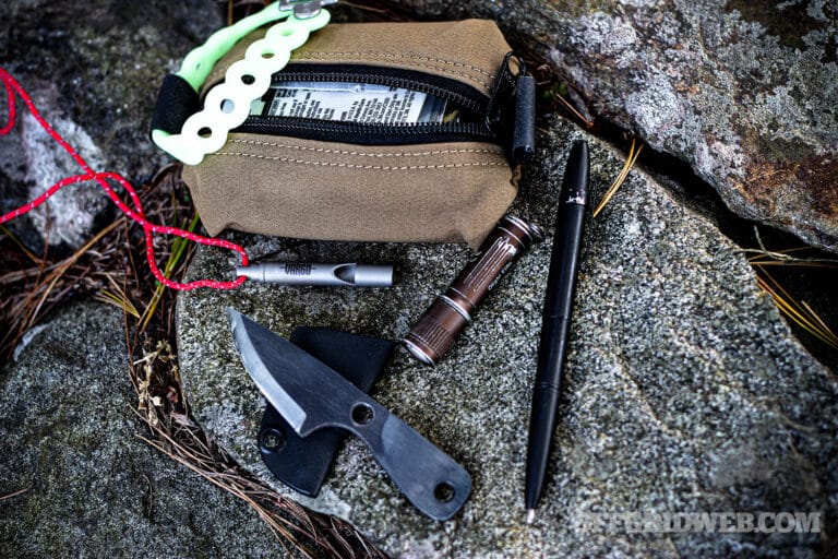 Image of a mini survival kit and small tools