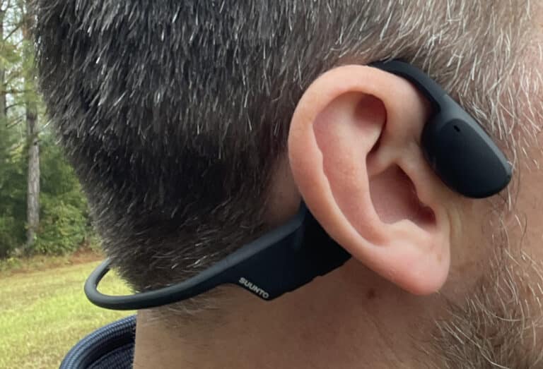 adult male wearing suunto's bone conduction headphones.