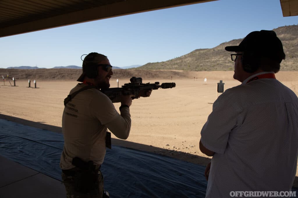 Instructor Michael Caughran walks VIPs through a rapid fire drill.