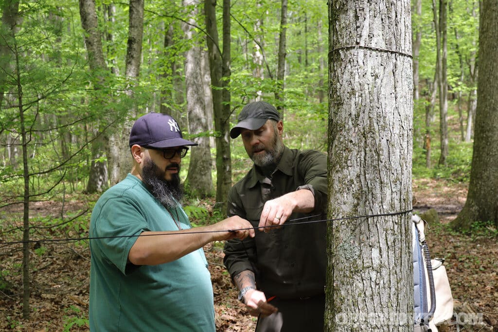 Jeff hatch helping student with a trucker hitch
