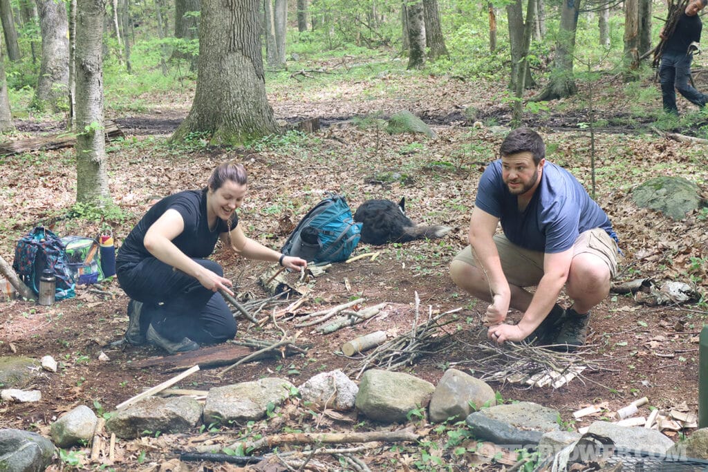 students practicing wilderness survival skills at raven wilderness school