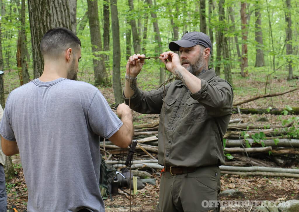 jeff hatch showing student how to manage para cord