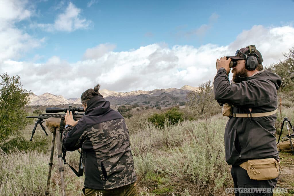 Instructor watching down range in precision shooting course