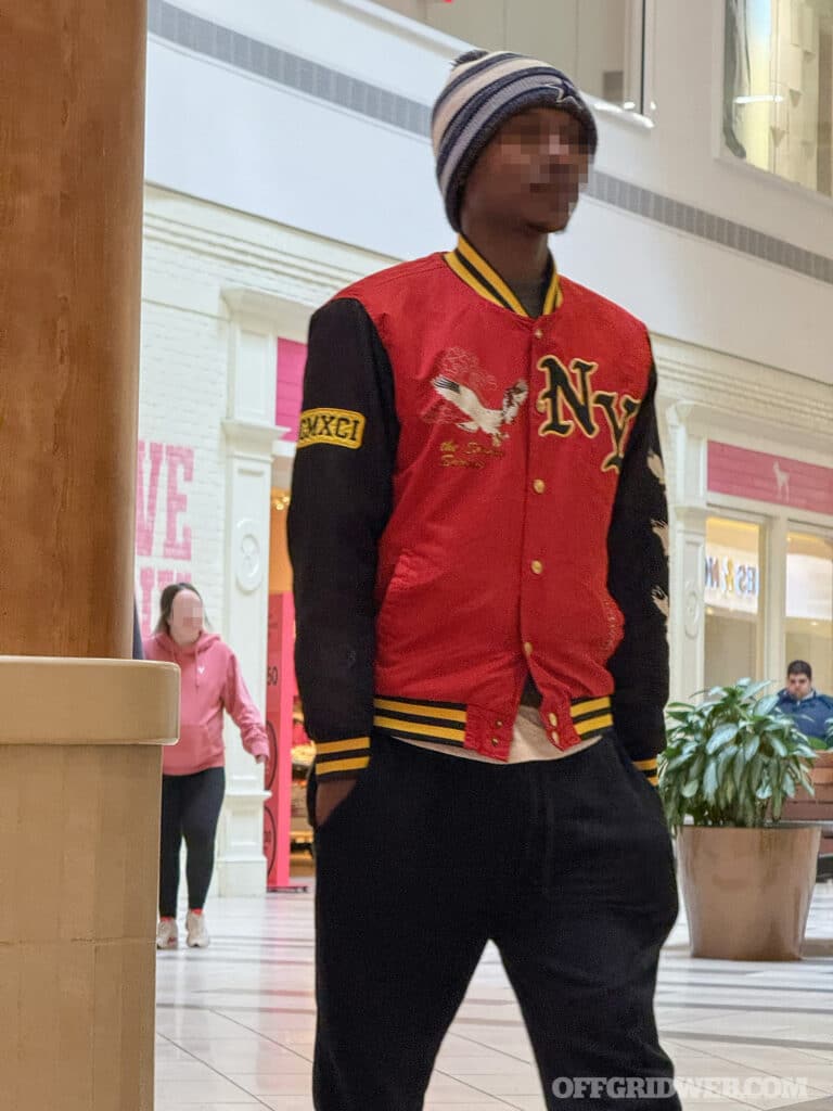 man with hand in pockets