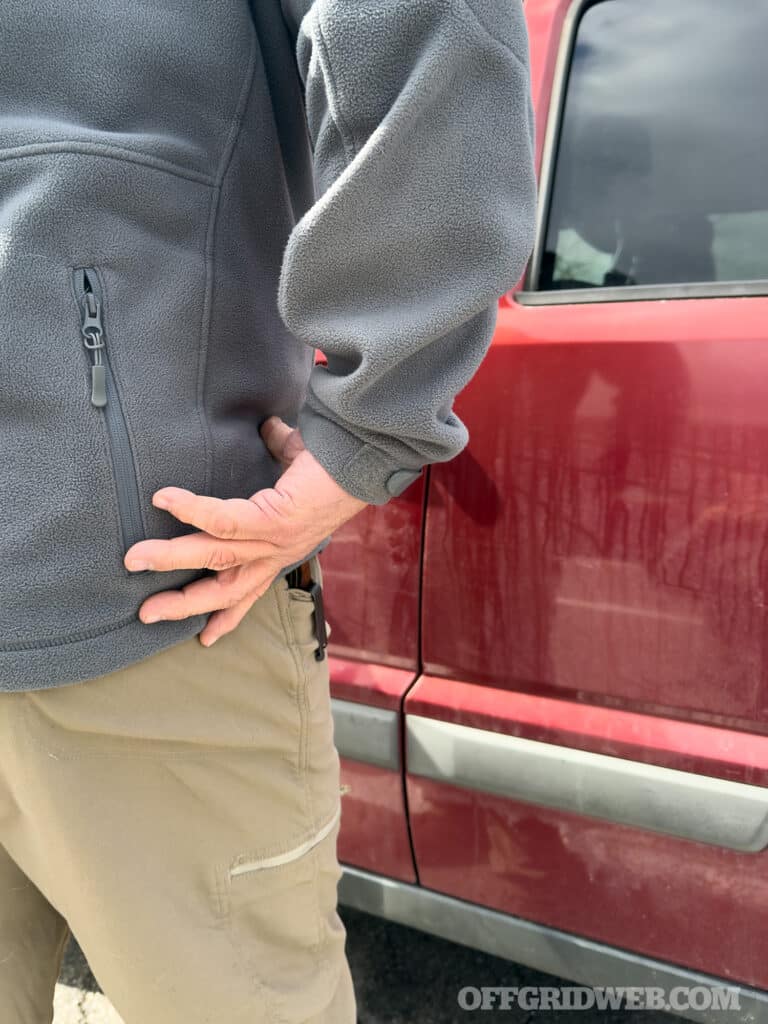 man adjusting clothing