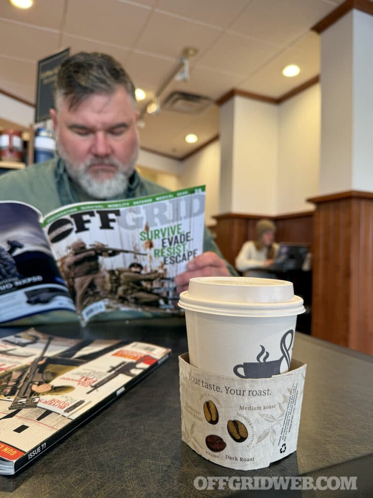 man reading magazine
