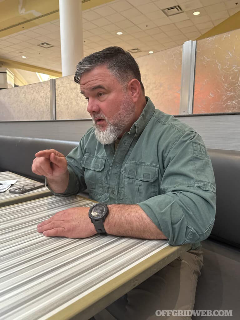 man pointing in a conversation