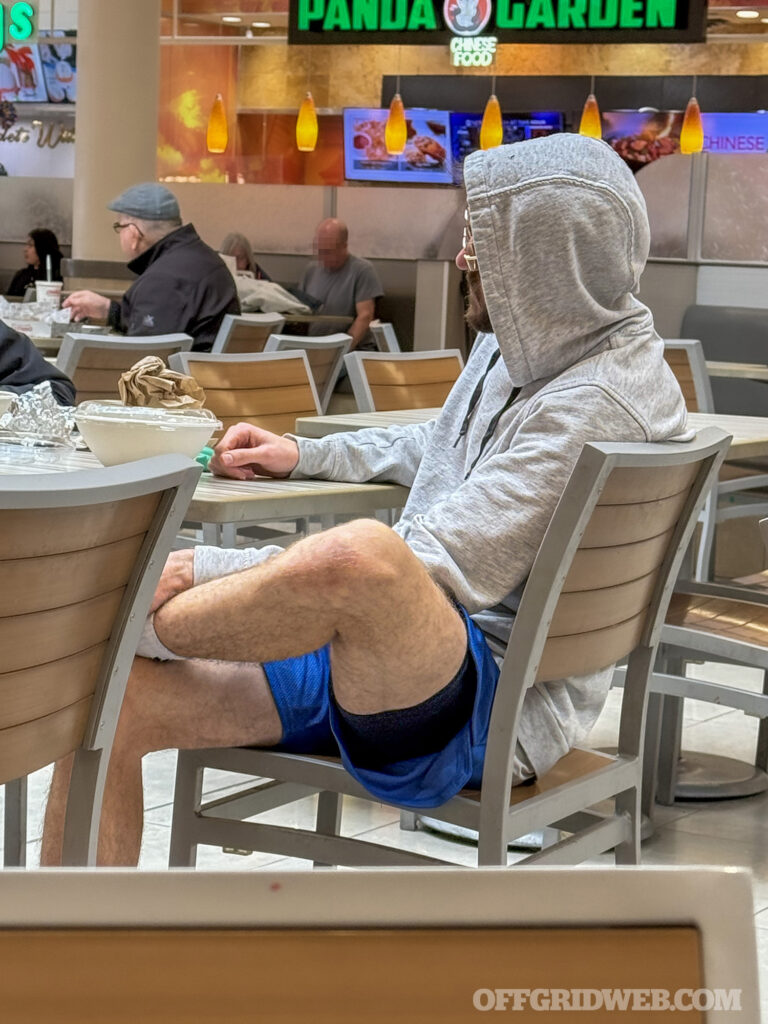 man sitting cross legged