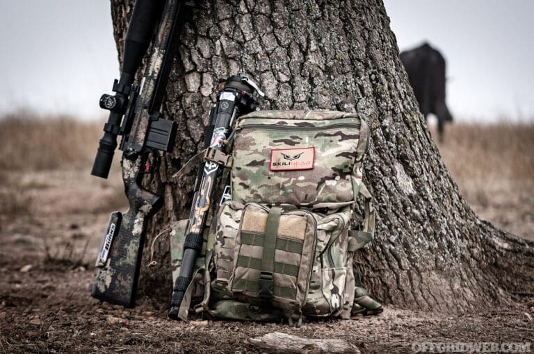Gear resting against a tree.