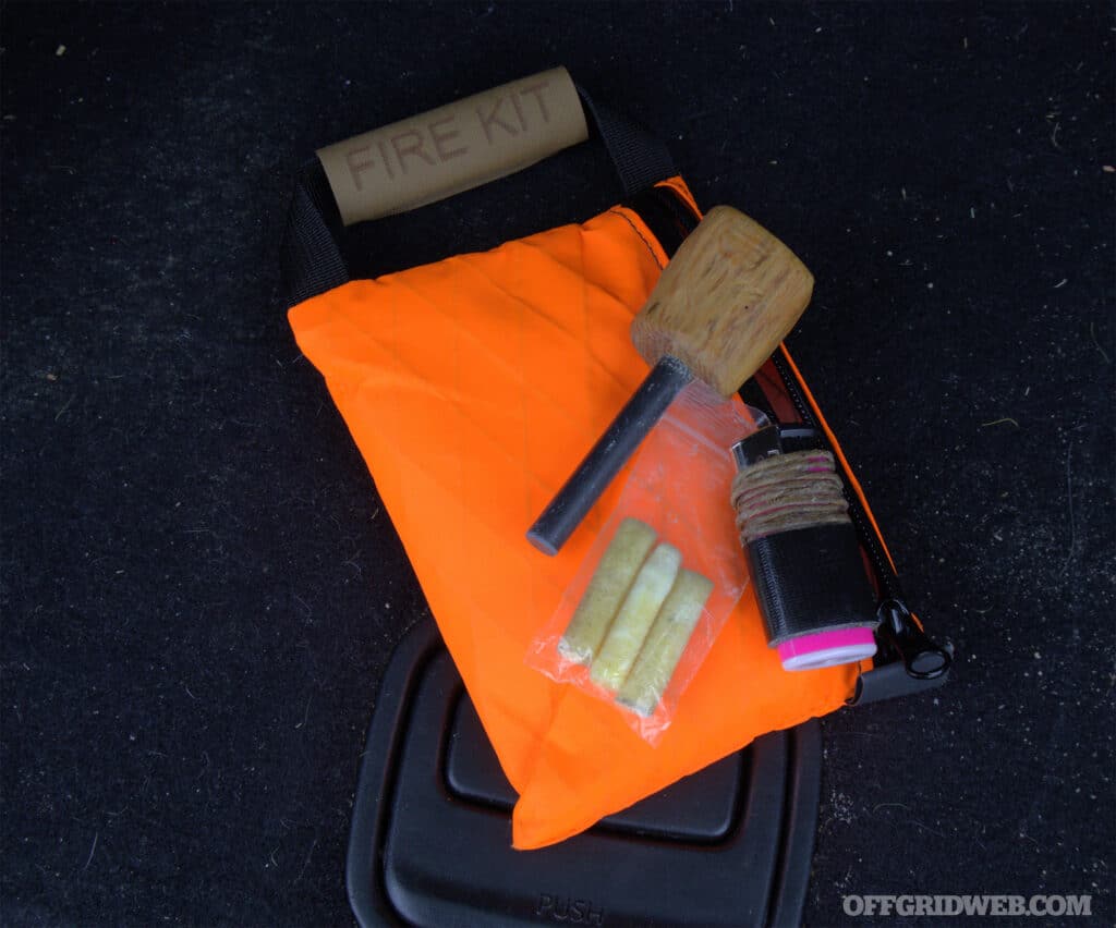 Fire is a great way to produce warmth and light that can be used to signal for help. A basic fire kit with multiple fire-starting tools and some man-made tinder can help you get a fire started even in wet conditions. This kit is stored in a Tuff Possum Personal Survival Kit pouch that is made from waterproof XPac material to ensure the contents stay dry.