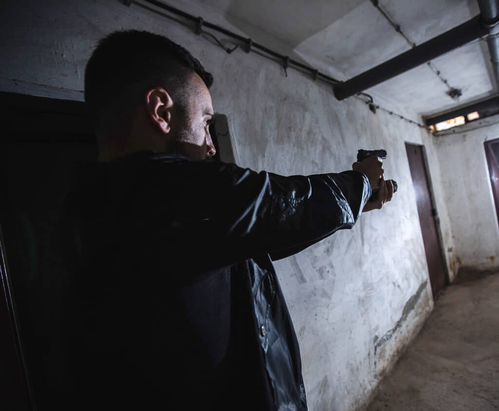 man with EDC firearm drawn