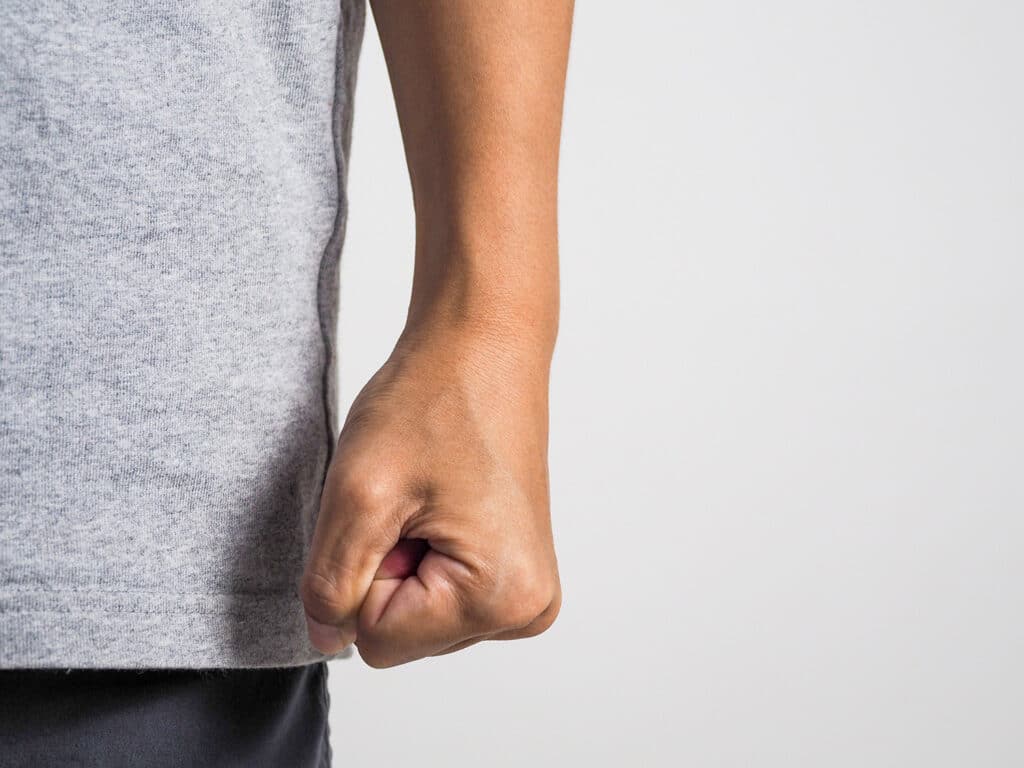 close up image of a man with a clenched fist