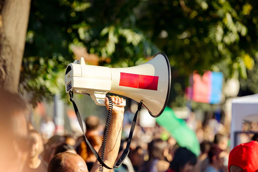 person holding up a megaphone
