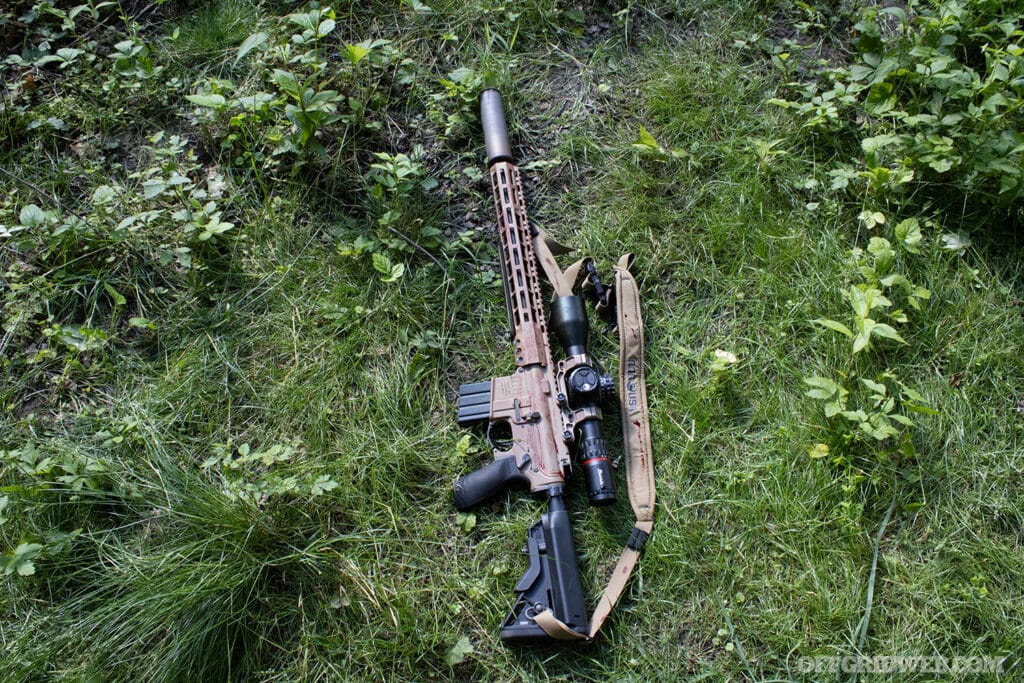 rifle in grass