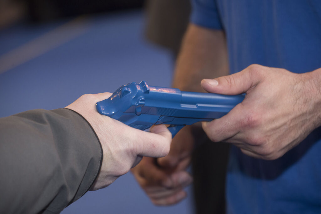 a blue training gun or pistol for self defense training
